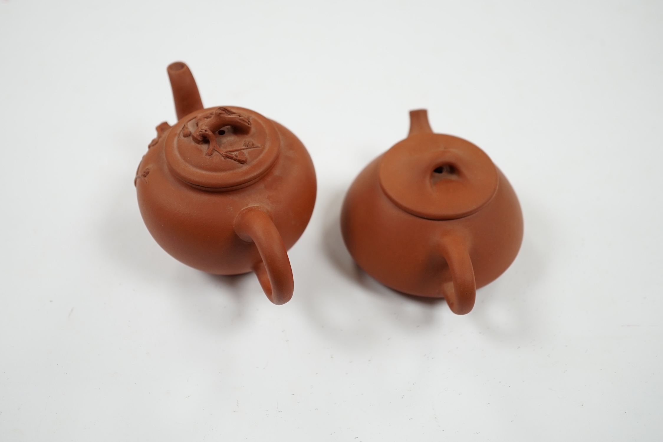 Two Chinese Yixing small teapots, largest 11.5cm wide. Condition - good